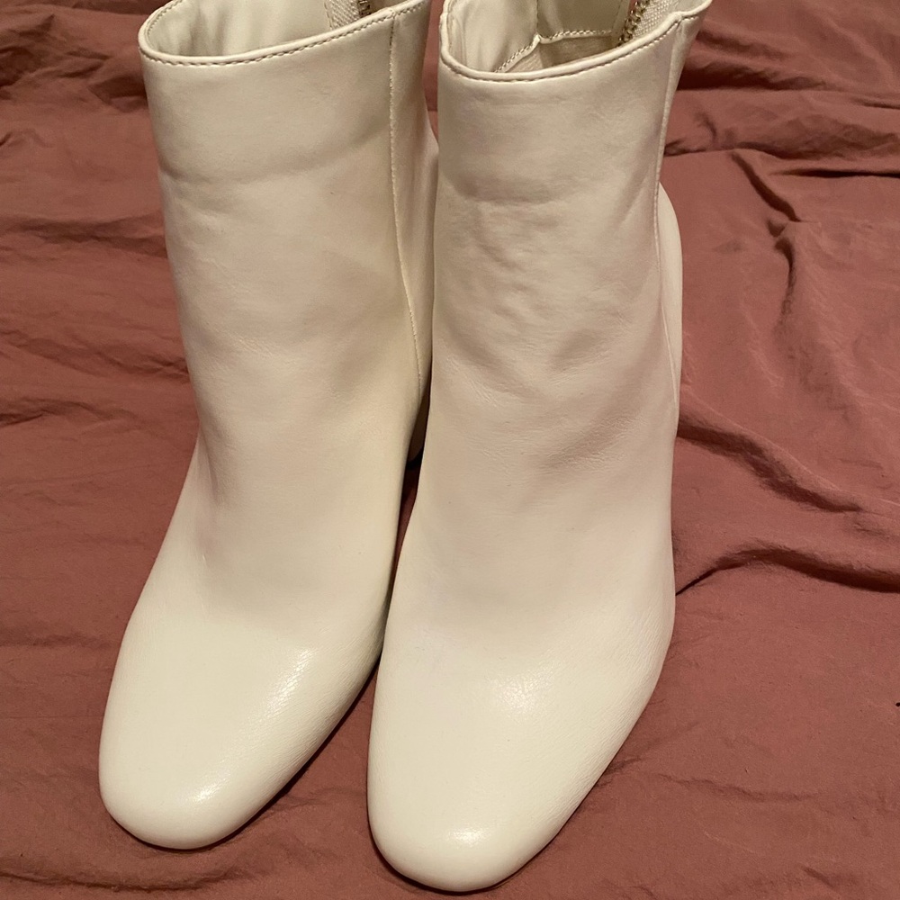 White booties, size 10, in new condition.